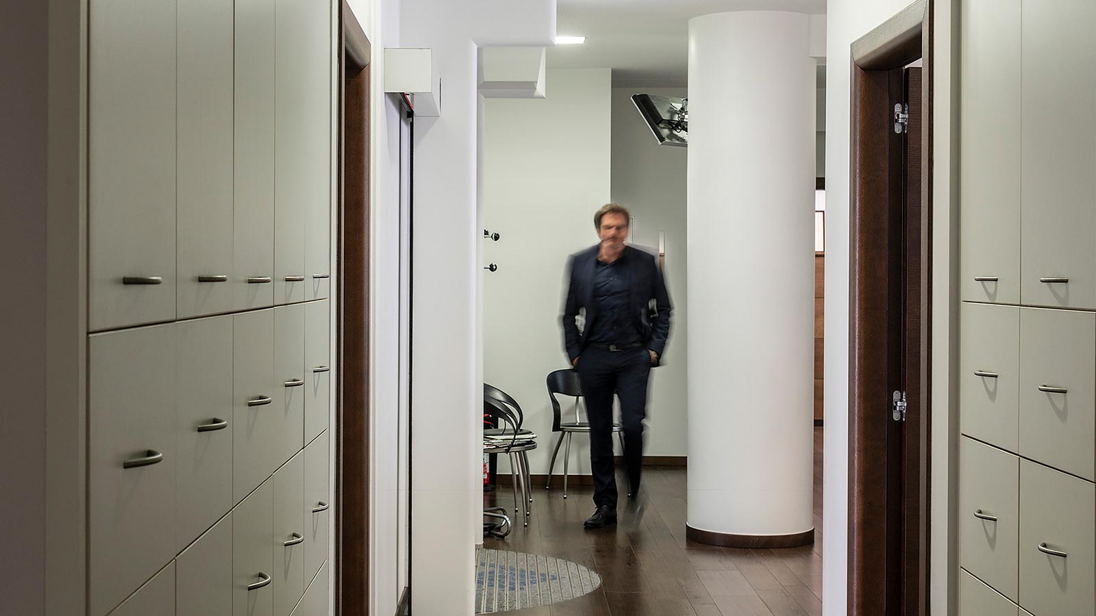 One of the tax consultants walks through the hallways of Studio Onepau in Bolzano
